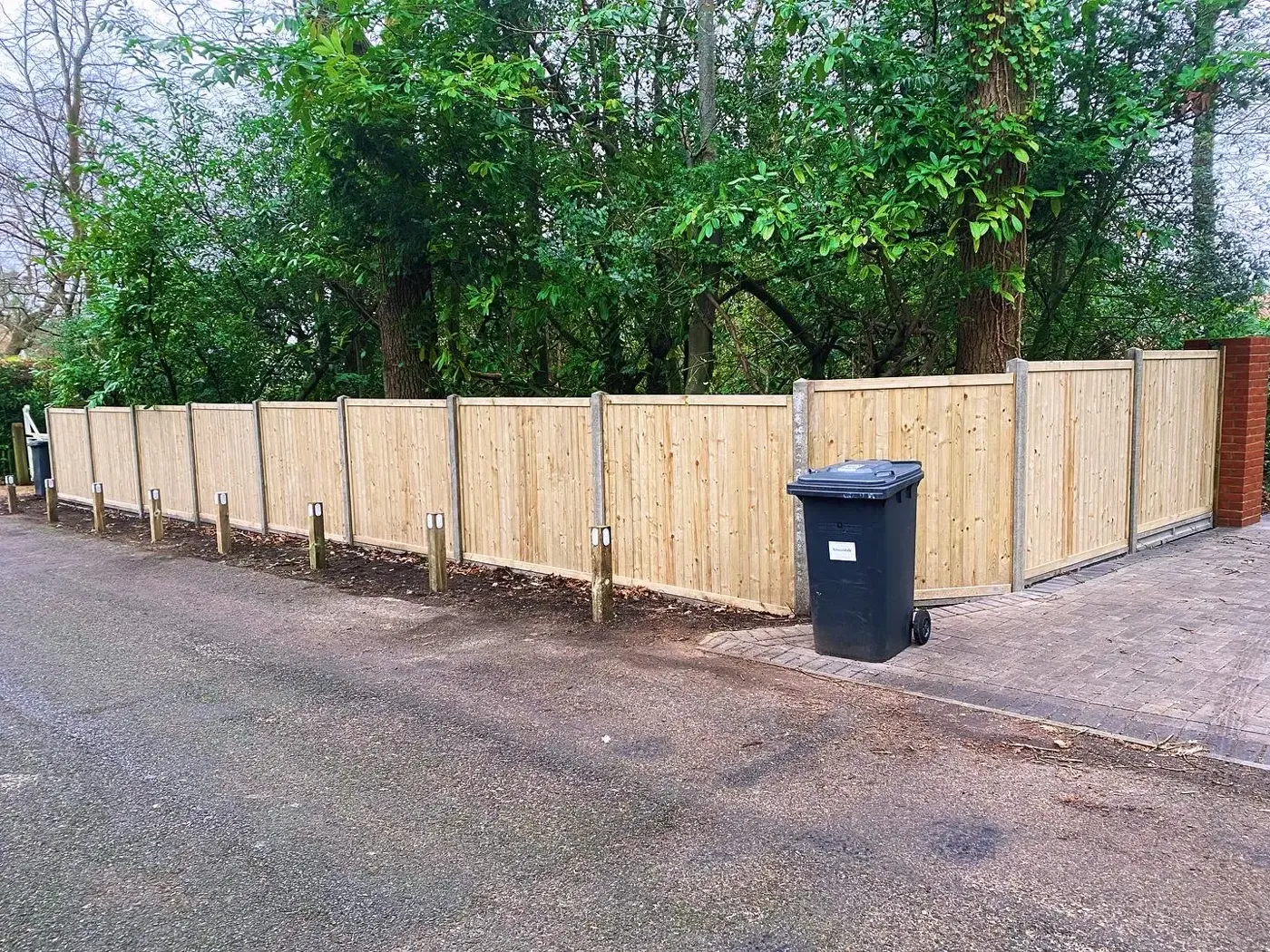 Closeboard fence installation completed in a Farnham garden